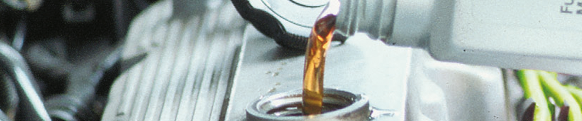 Lubricants for automotive engine oils Engine oil being poured into a car engine