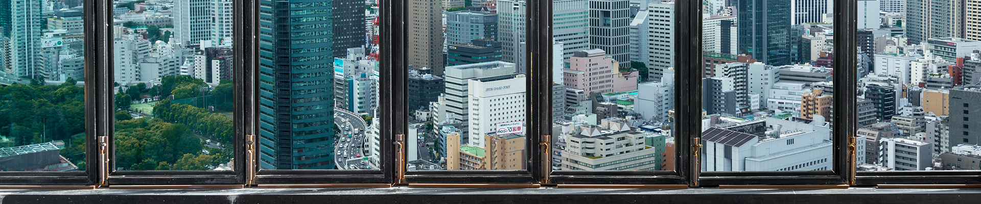 View over a city from behind the windows
