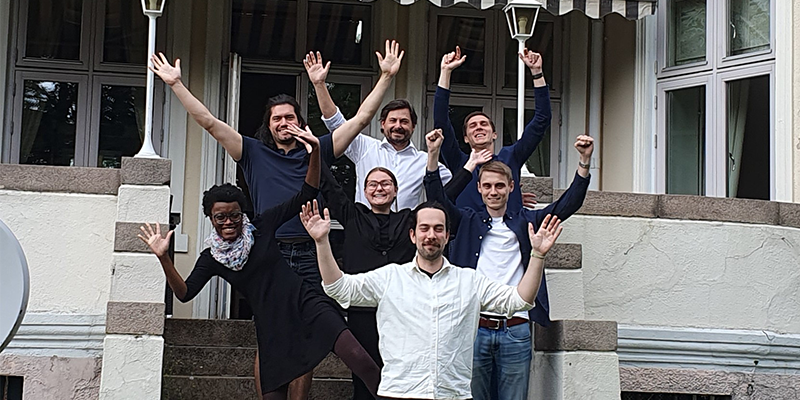 Group photo of Perstorp trainees in front of a house