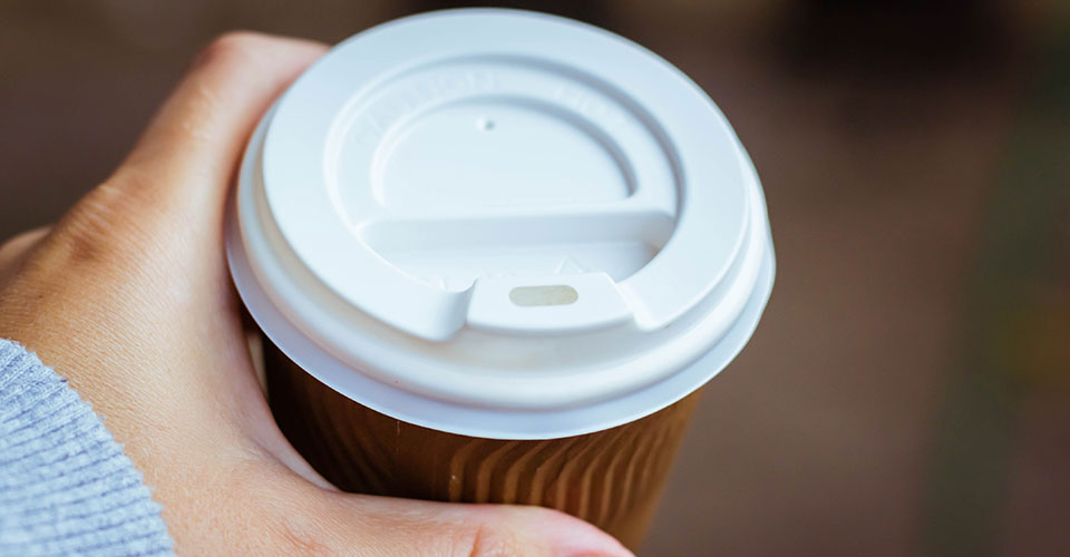 Cup with plastic lid