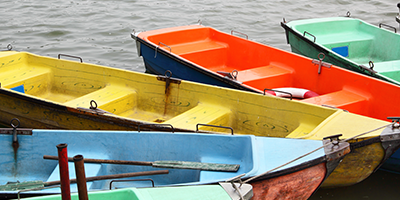 plastic rowing boats in different vibrant colors