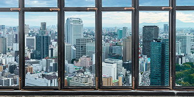 Liquid saturated polyesters view over a city from behind windows