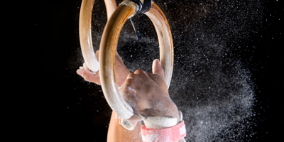 performance a person holding gymnastics rings