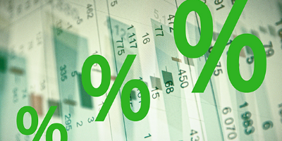 Profitability % signs over spreadsheets showing profitability