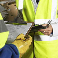 Workers holding documents