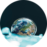 Water drop with a reflection of the earth in it 